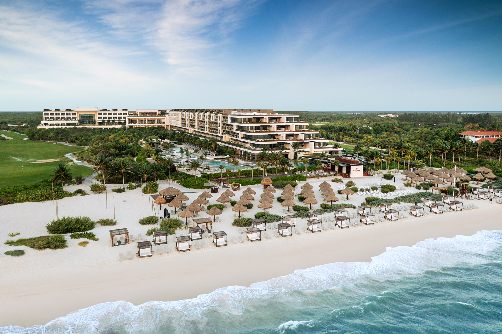 ATELIER Playa Mujeres adults-only all-inclusive resort with oceanfront beach, palapas, and modern resort buildings.