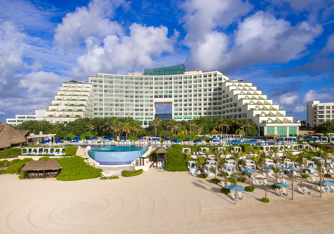 Live Aqua Beach Resort Cancun oceanfront luxury resort in Cancun Hotel Zone with infinity pools, beachfront loungers, and Caribbean Sea views.