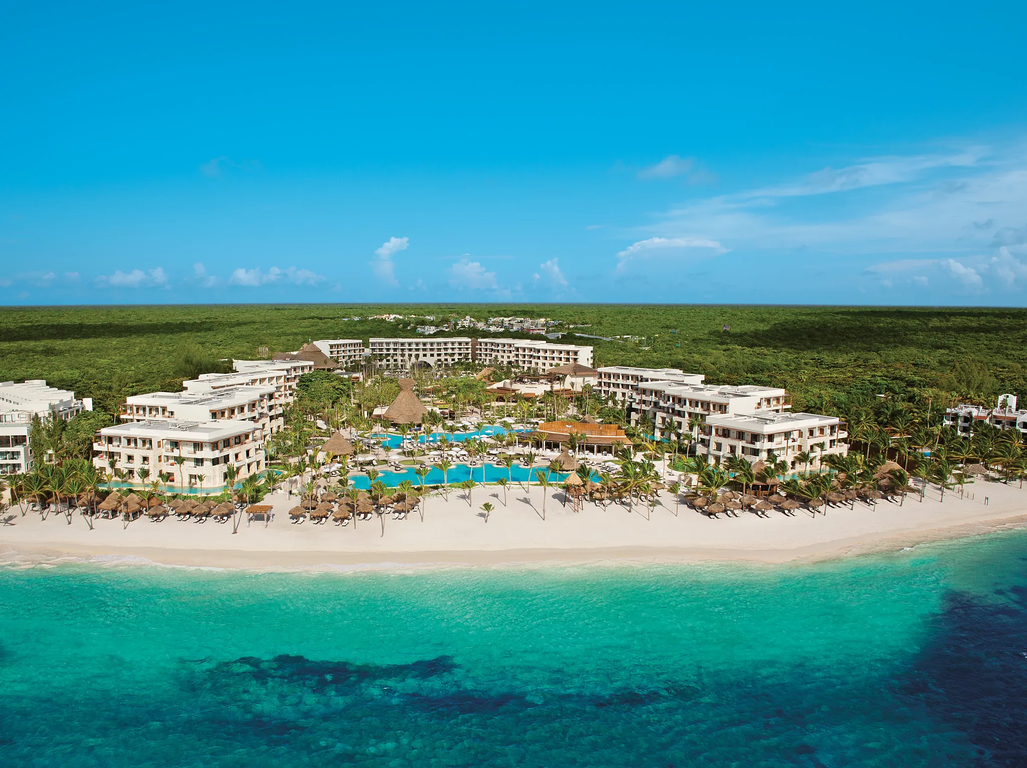 Secrets Akumal Riviera Maya adults-only all-inclusive resort set on Akumal Beach with oceanfront pools and tropical gardens.