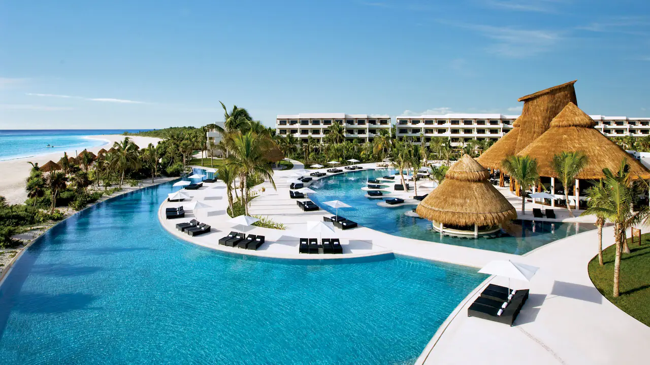 Secrets Maroma Beach Riviera Cancun adults-only all-inclusive resort on Maroma Beach with white sand, turquoise water, and luxury pools.