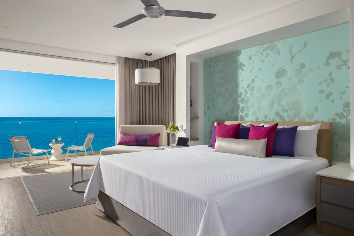 Xcelerate Junior Suite Ocean Front at Breathless Riviera Cancun featuring a king bed, modern décor, and direct ocean views from the room.